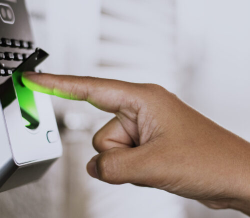 Scanning finger on a coronavirus contaminated fingerprint access control Scanning finger on a coronavirus contaminated fingerprint access control